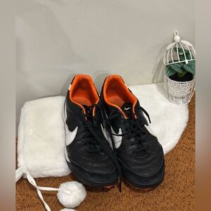 Nike Black Athletic Shoes with Orange and White Accents